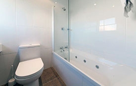 ensuite bathroom with a spa bath